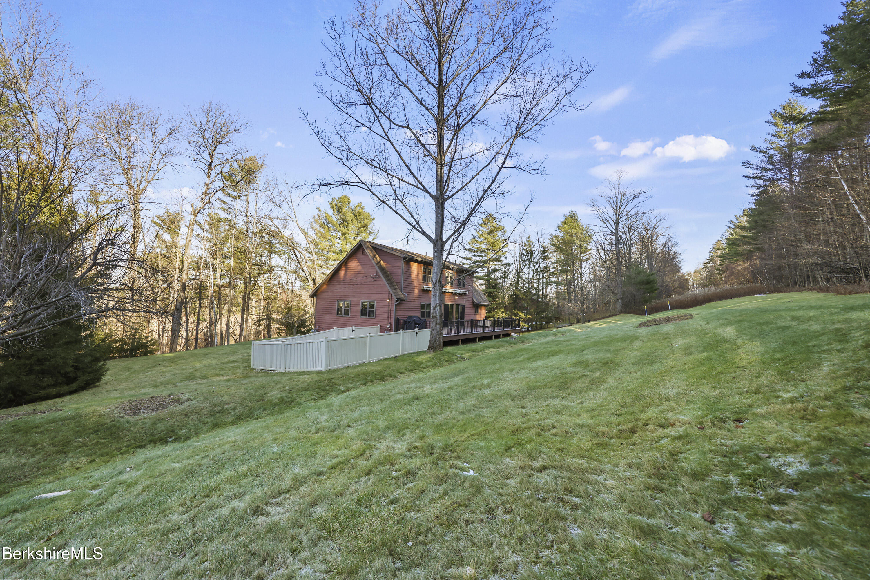 551 Tamarack Road Pittsfield, MA 01201 - Photo 44 of 51 a backyard of a house with lots of green space