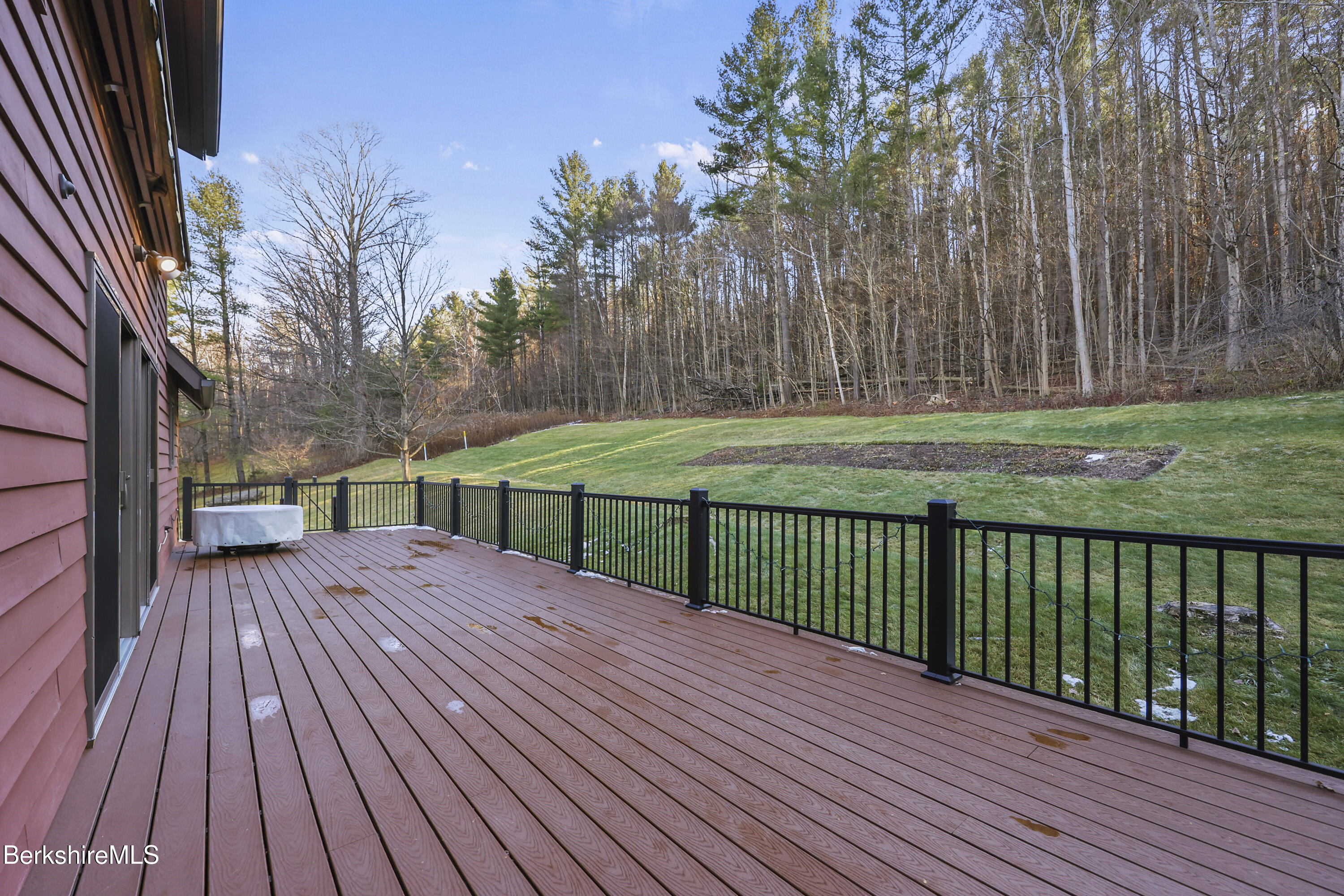 551 Tamarack Road Pittsfield, MA 01201 - Photo 49 of 51 a view of backyard with deck and wooden floor