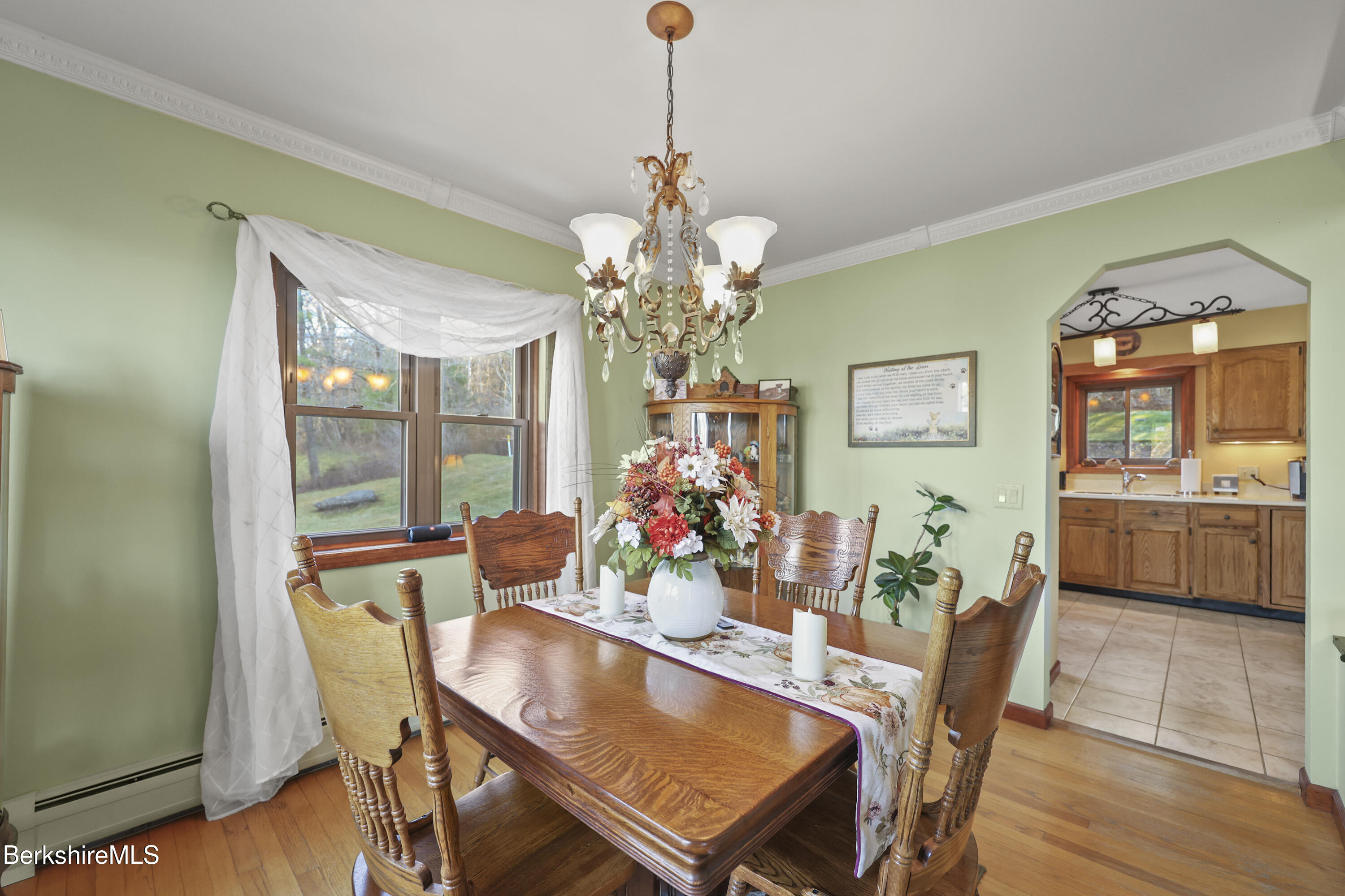 551 Tamarack Road Pittsfield, MA 01201 - Photo 10 of 51 a view of a dining room with furniture and wooden floor
