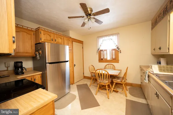 a view of livingroom with hardwood floor and a ceiling fan