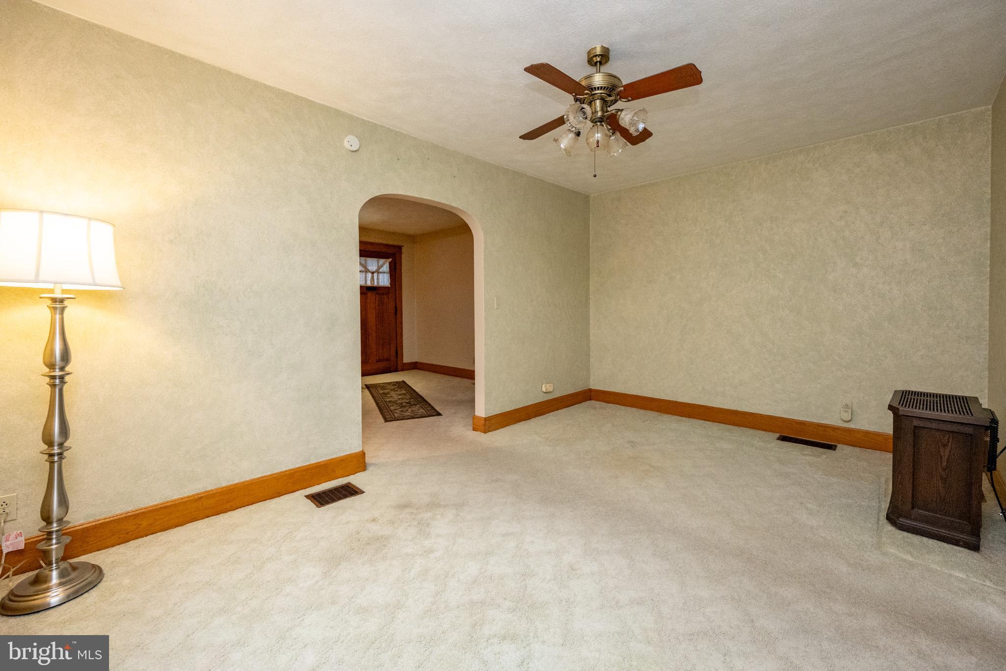 313 West Liberty Street Oakland, MD 21550 - Photo 18 of 59 a view of livingroom with hardwood floor and a ceiling fan
