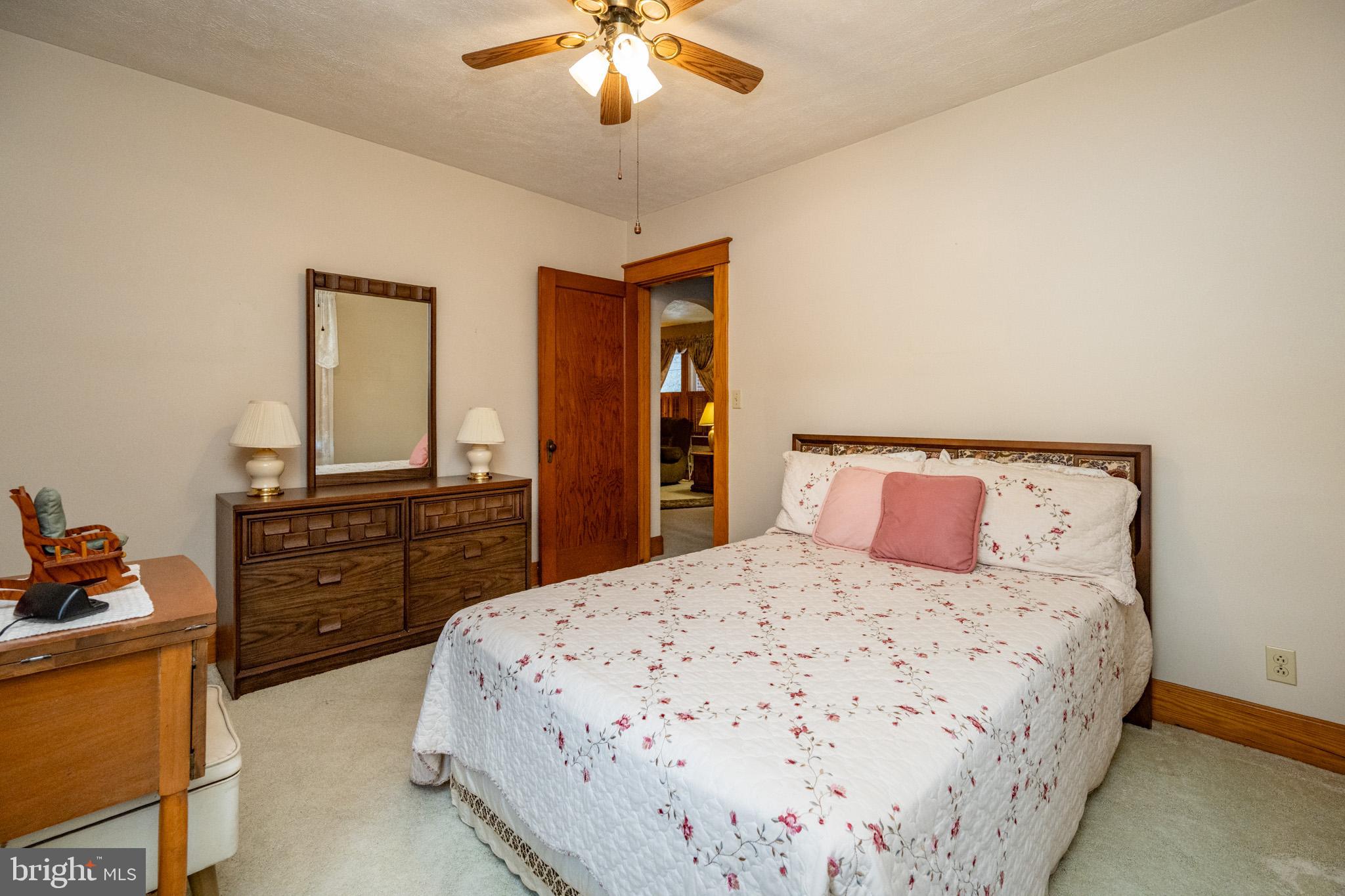 313 West Liberty Street Oakland, MD 21550 - Photo 26 of 59 a bedroom with a bed and wooden floor