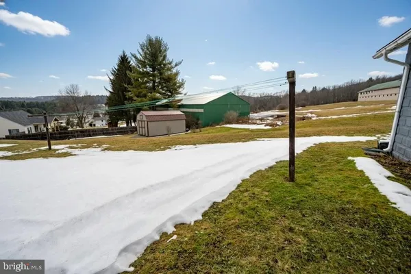 a view of a swimming pool with a yard