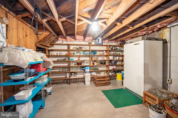 a view of a patio with chair and tables