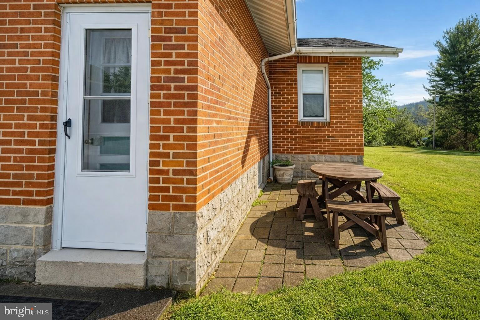 313 West Liberty Street Oakland, MD 21550 - Photo 40 of 59 a view of a patio with table and chairs and potted plants