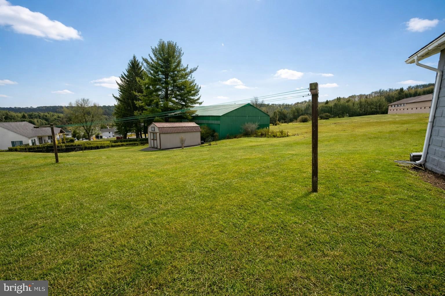 313 West Liberty Street Oakland, MD 21550 - Photo 4 of 59 a view of a big yard with a slide