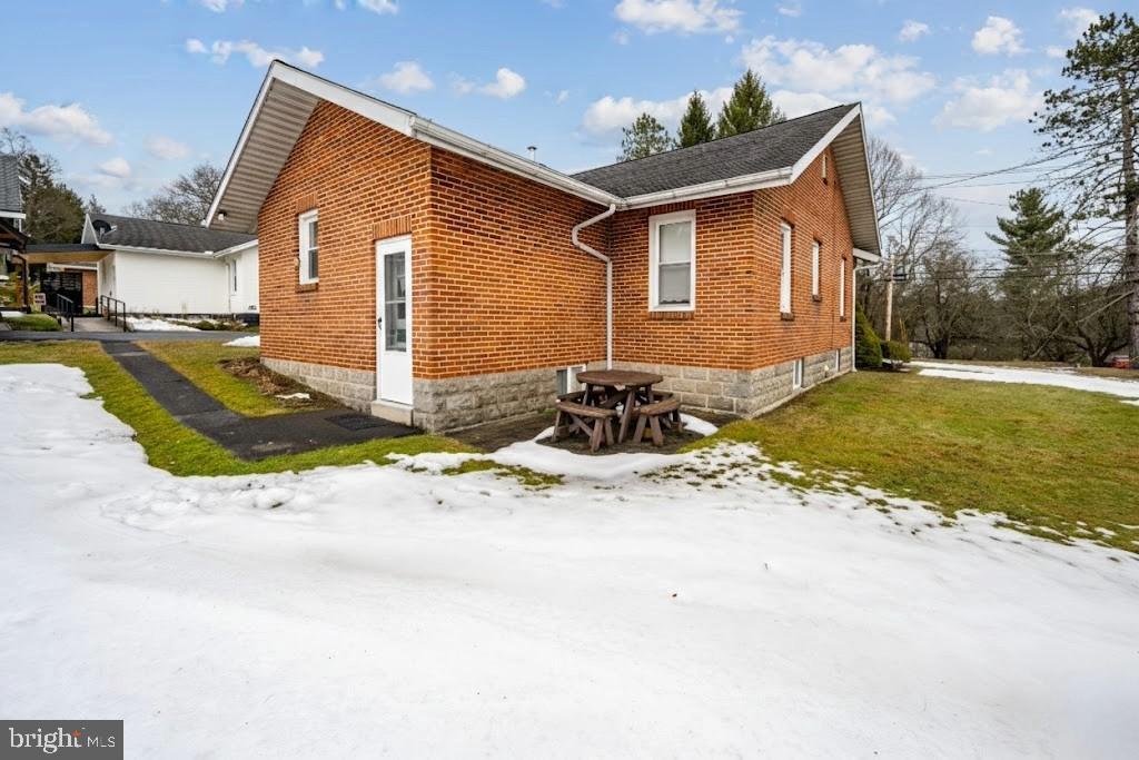 313 West Liberty Street Oakland, MD 21550 - Photo 41 of 59 a front view of a house with a yard