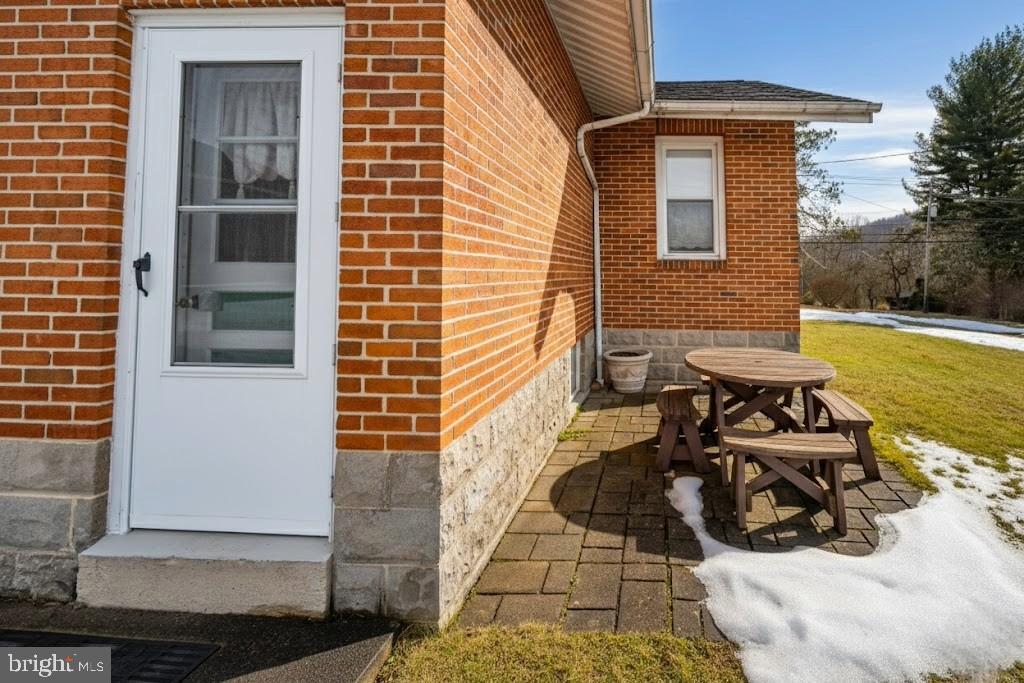 313 West Liberty Street Oakland, MD 21550 - Photo 43 of 59 a view of a patio with chair and tables