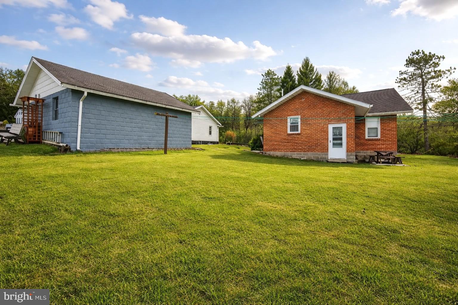 313 West Liberty Street Oakland, MD 21550 - Photo 45 of 59 a big house with a big yard and large trees