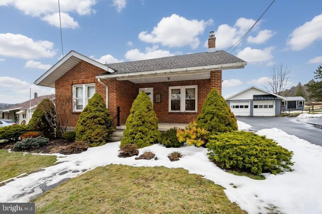 313 West Liberty Street Oakland, MD 21550 - Photo 53 of 59 a front view of a house with a yard