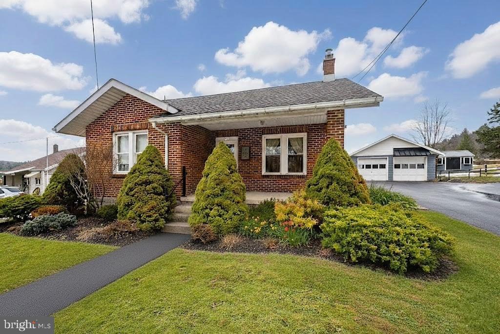 313 West Liberty Street Oakland, MD 21550 - Photo 55 of 59 a front view of a house with a yard