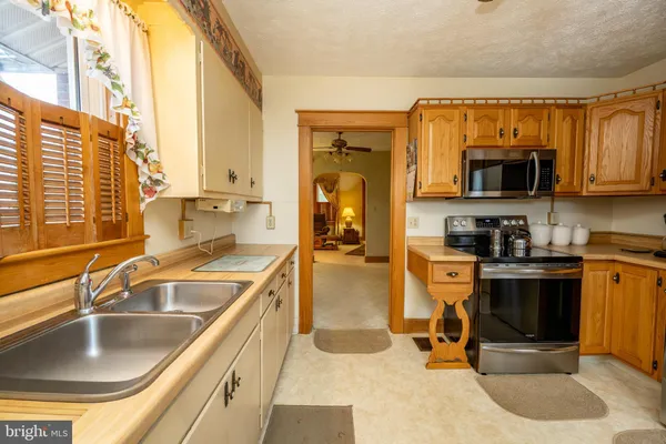 a view of cabinets a window and a wooden floor