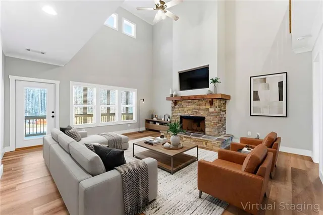 a living room with furniture fireplace and a flat screen tv