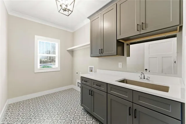 a kitchen with a sink cabinets and window