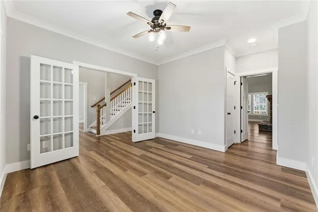 wooden floor in an empty room with a window