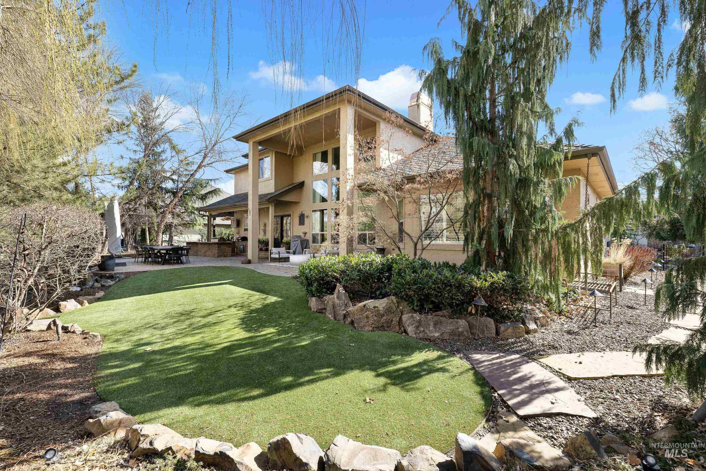 1166 East Rivers End Drive Eagle, ID 83616 - Photo 1 of 50 View of green lawn with a patio area