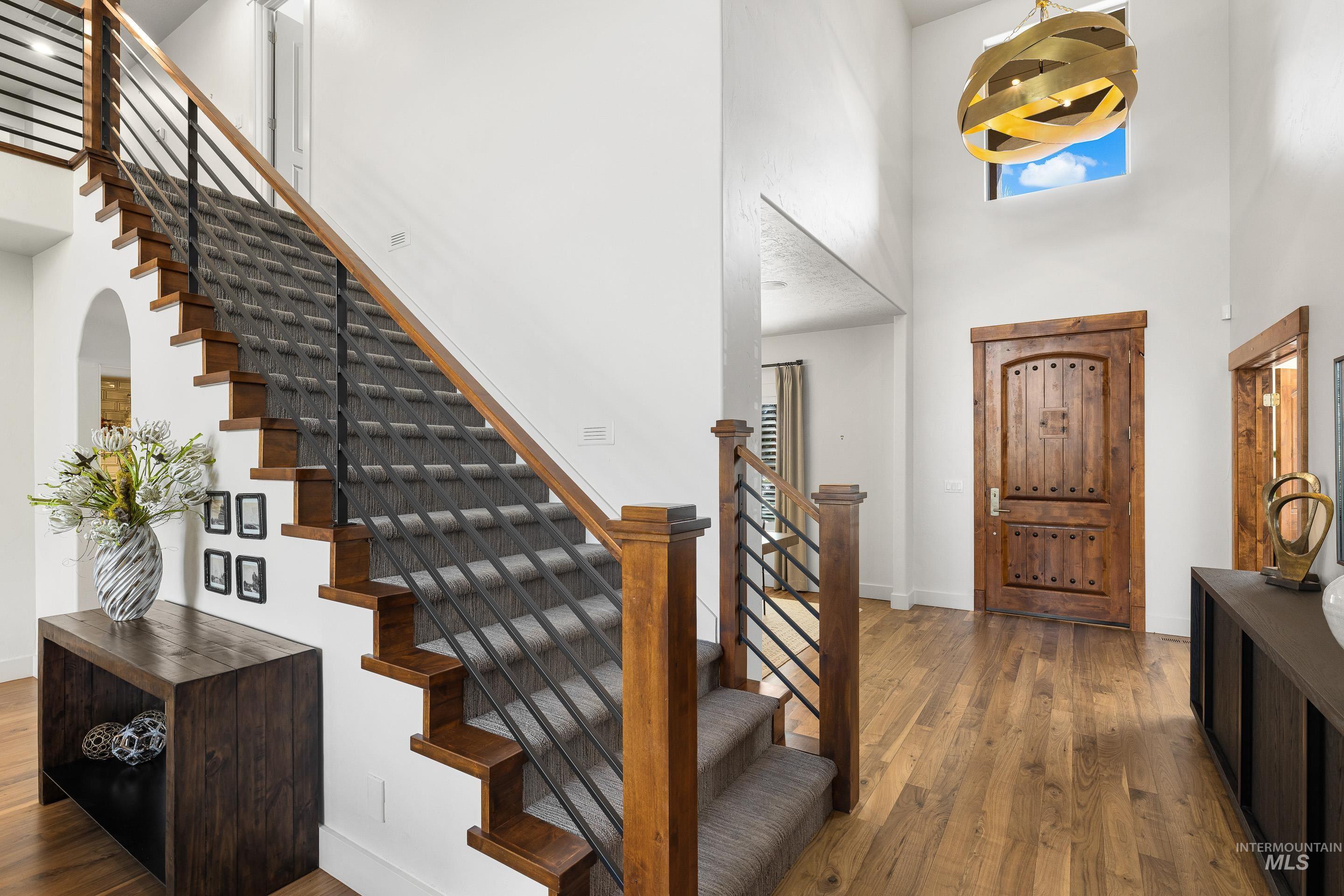 1166 East Rivers End Drive Eagle, ID 83616 - Photo 18 of 50 Entryway featuring a high ceiling and dark wood-style flooring