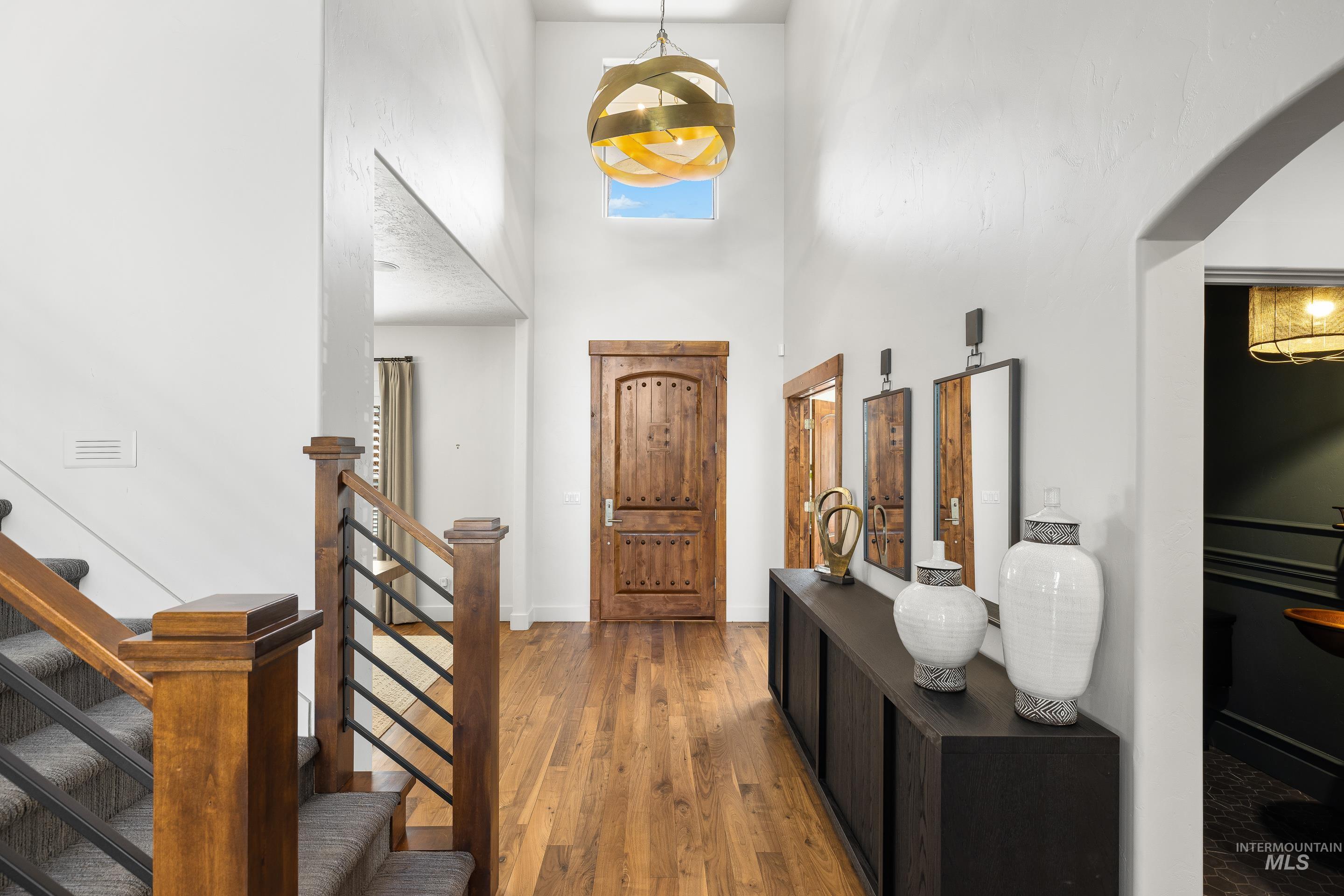 1166 East Rivers End Drive Eagle, ID 83616 - Photo 3 of 50 Entryway with light wood finished floors and a high ceiling