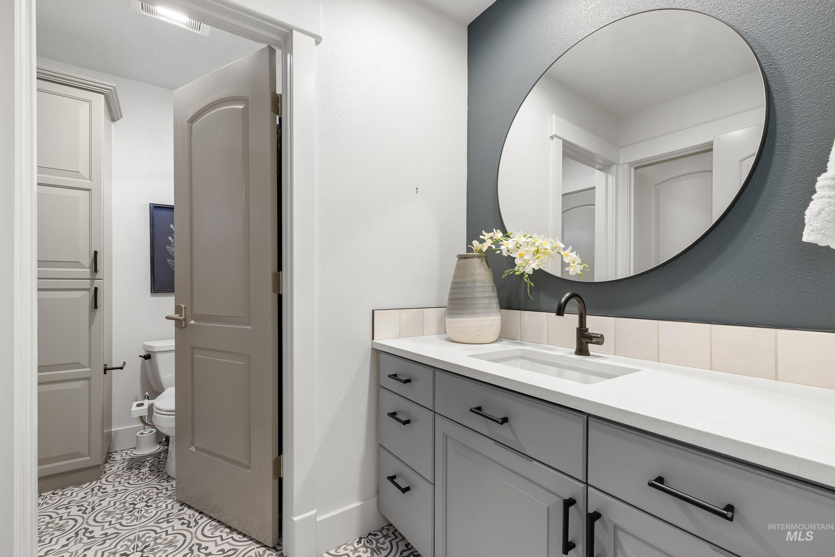 1166 East Rivers End Drive Eagle, ID 83616 - Photo 35 of 50 Bathroom featuring vanity and a textured wall
