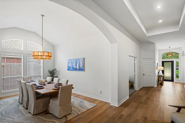 a view of a dining room with furniture window and wooden floor