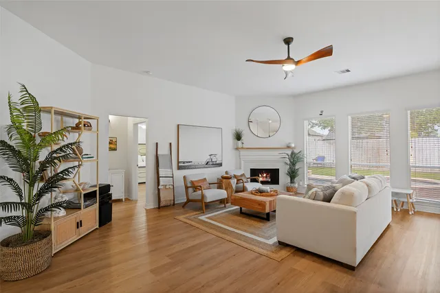 a living room with furniture fireplace and flat screen tv