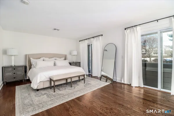 a bathroom with a glass shower door