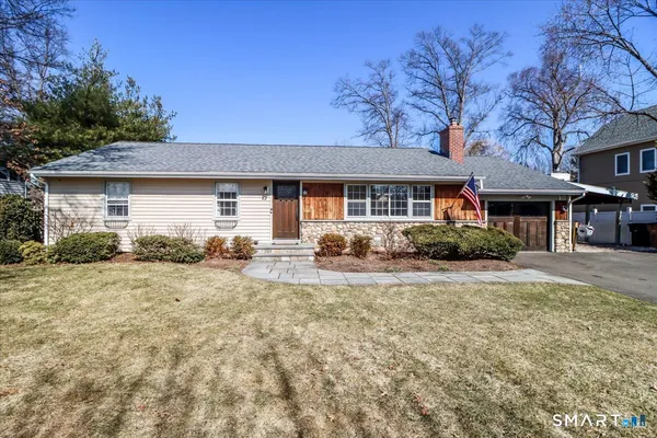 a front view of a house with a patio