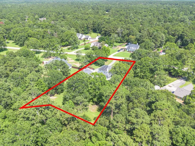 a view of a yard with an empty space and deck