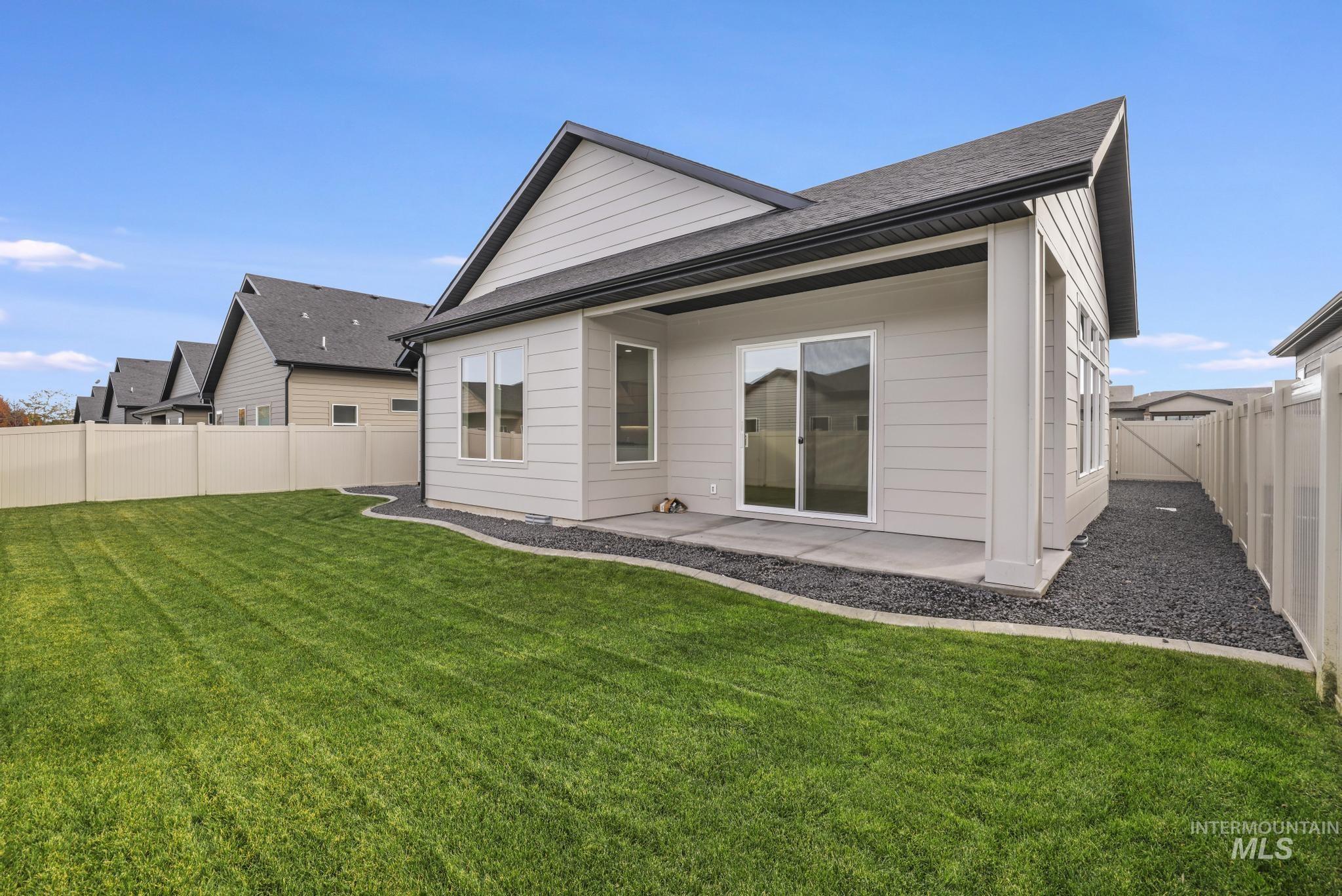 542 Falling Leaf Lane Twin Falls, ID 83301 - Photo 34 of 38 Back of house with a fenced backyard and a patio area