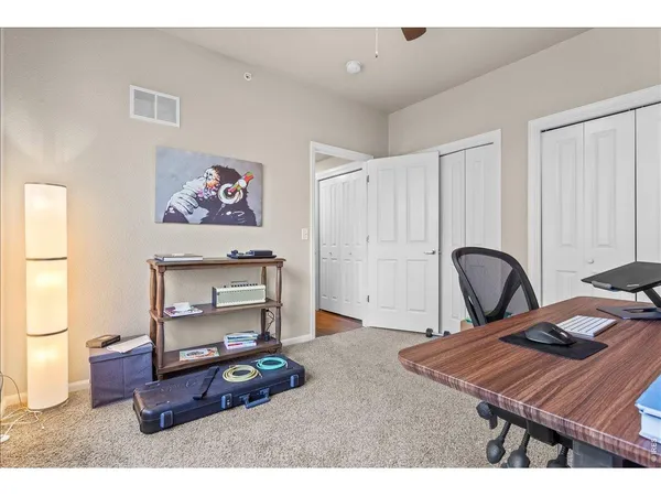 a bedroom with furniture and a piano