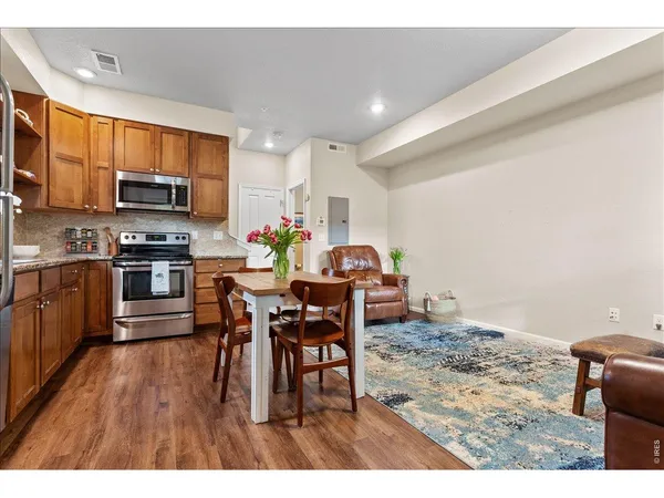 a kitchen with a table and chairs in it