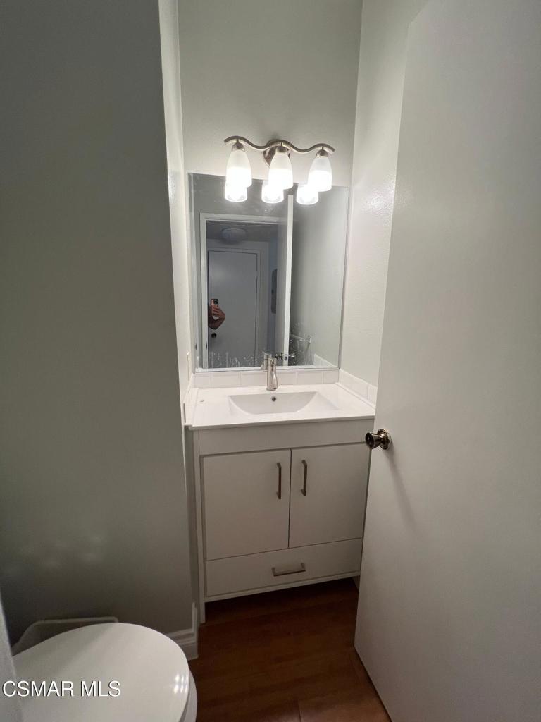 86 Maegan Place, Unit 10 Thousand Oaks, CA 91362 - Photo 11 of 15 a bathroom with a sink a toilet and mirror