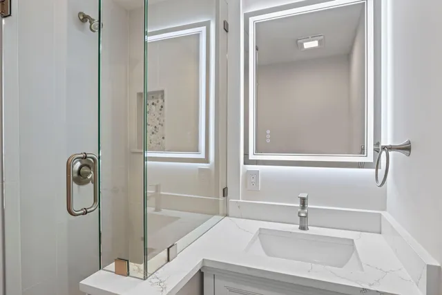 a bathroom with a sink and a mirror