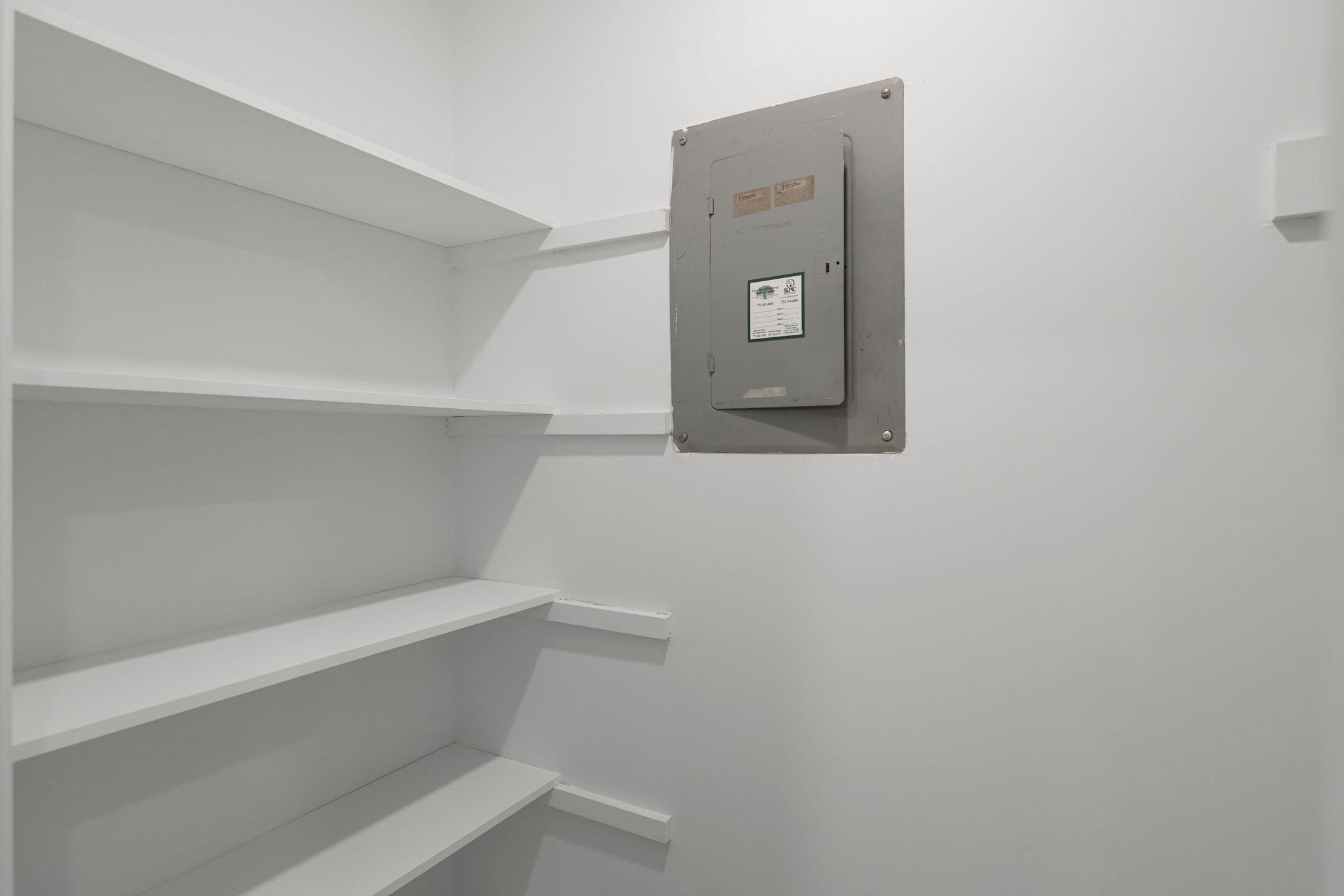 2929 Southeast Ocean Boulevard, Unit 1406 Stuart, FL 34996 - Photo 20 of 27 a view of staircase with white walls and white door