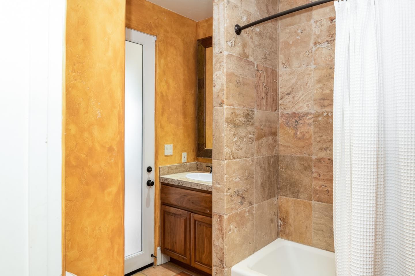 27835 Mesa Del Toro Road Salinas, CA 93908 - Photo 21 of 44 a bathroom with a granite countertop sink and a mirror