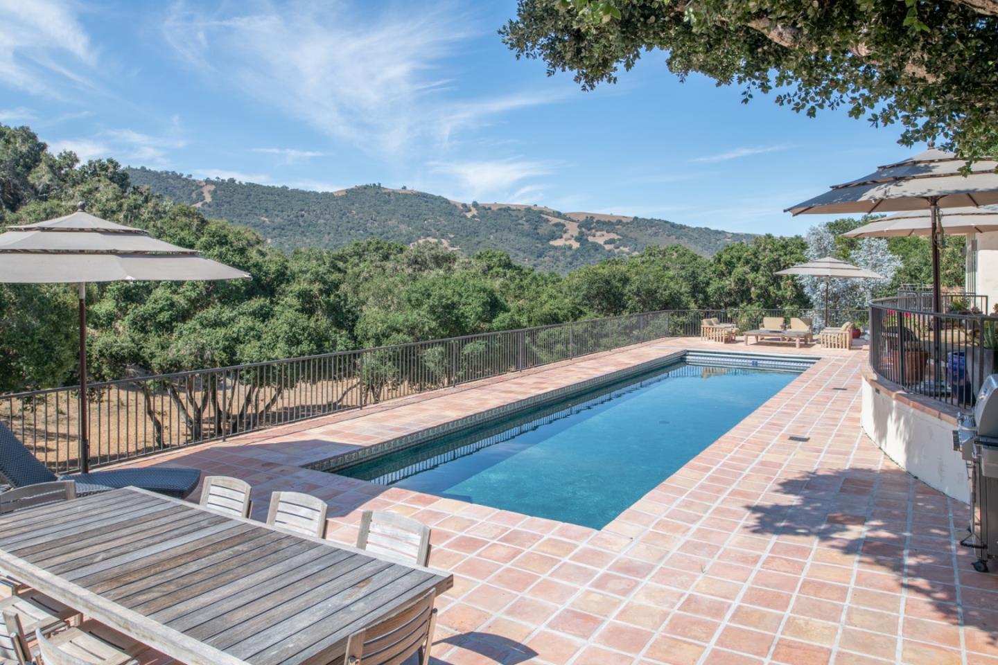 27835 Mesa Del Toro Road Salinas, CA 93908 - Photo 27 of 44 a view of a swimming pool with a lounge chair