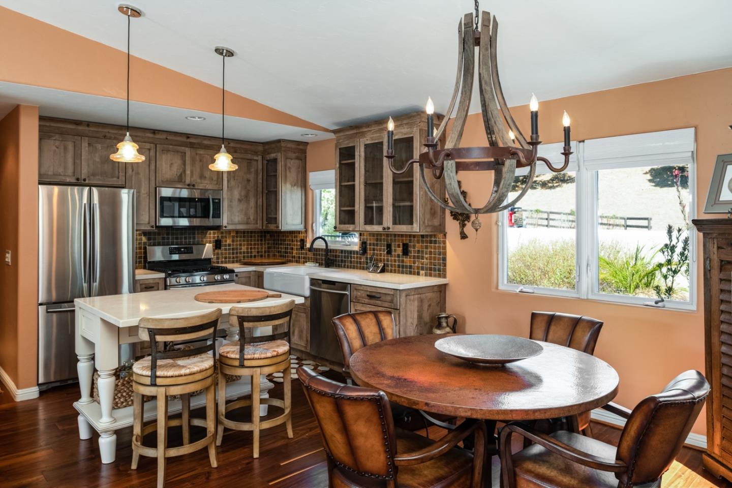 27835 Mesa Del Toro Road Salinas, CA 93908 - Photo 40 of 44 a kitchen with stainless steel appliances a dining table chairs and a window