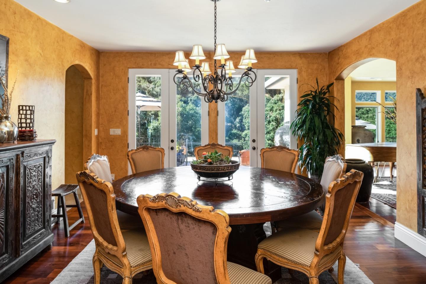 27835 Mesa Del Toro Road Salinas, CA 93908 - Photo 4 of 44 a view of a dining room with furniture wooden floor and chandelier