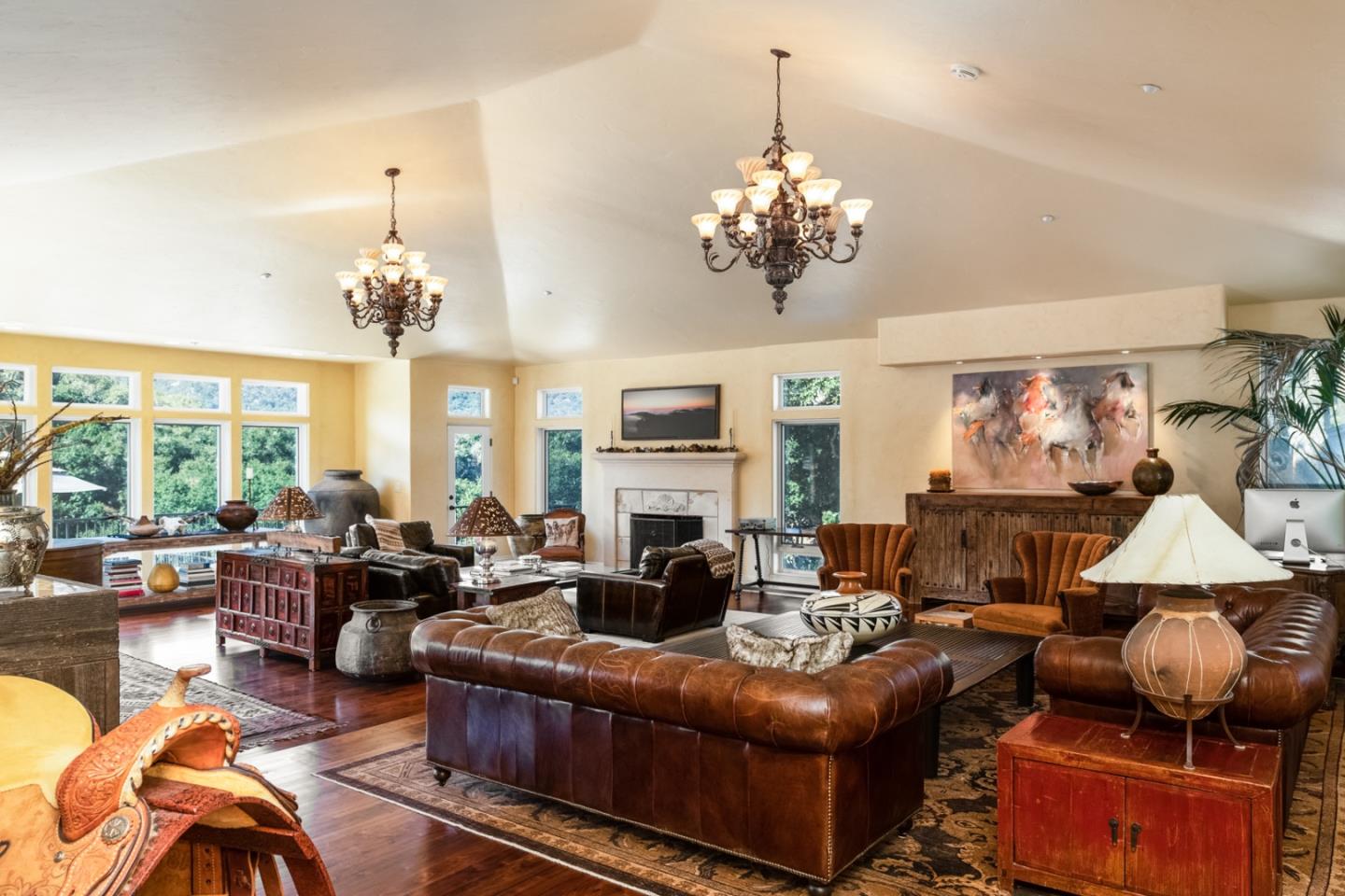 27835 Mesa Del Toro Road Salinas, CA 93908 - Photo 5 of 44 a living room with furniture a chandelier and a fireplace