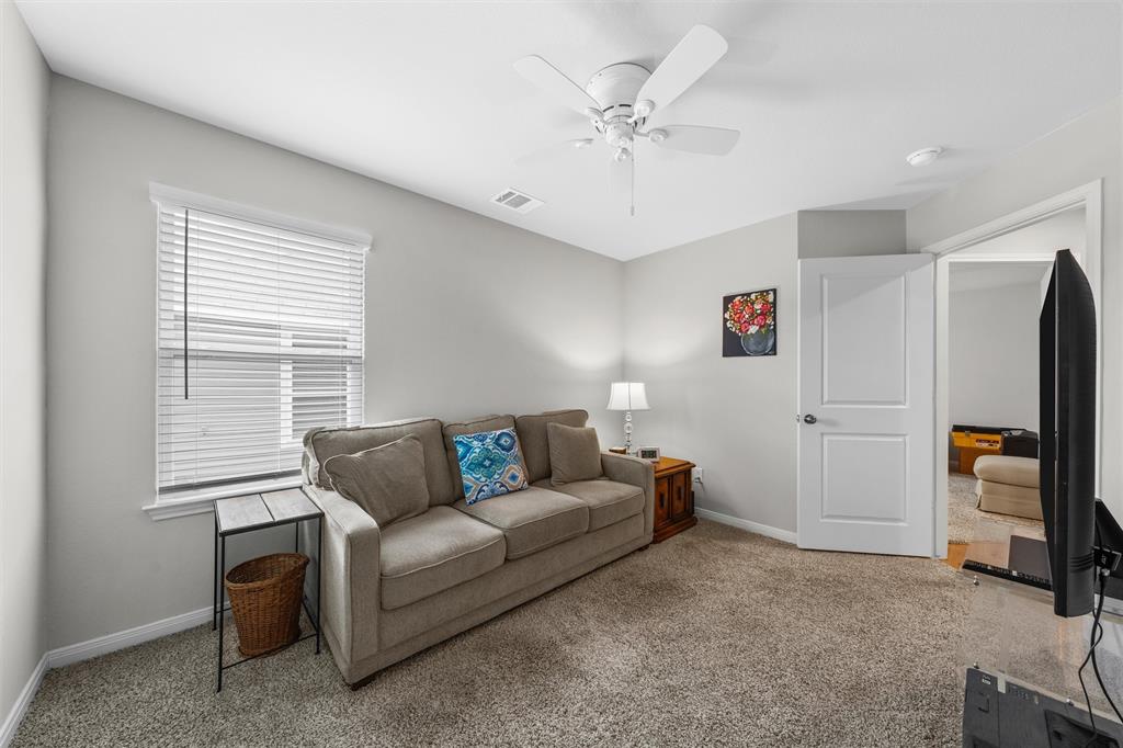 4056 Centerfire Road Waco, TX 76705 - Photo 18 of 27 a living room with furniture and a flat screen tv