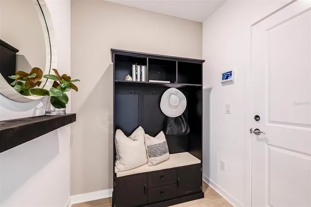 a living room with furniture and a potted plant