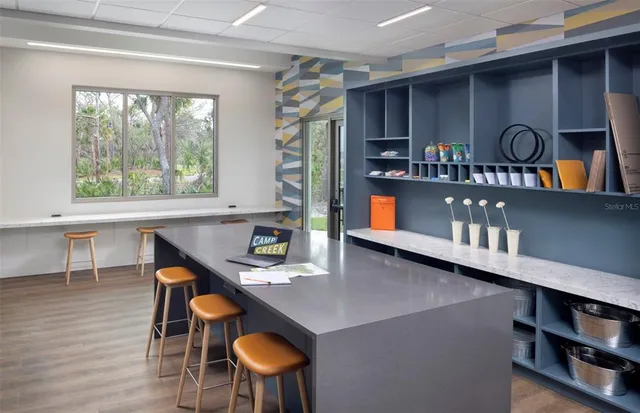 a workspace with furniture and window