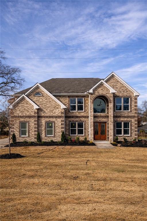 a front view of a house with a yard