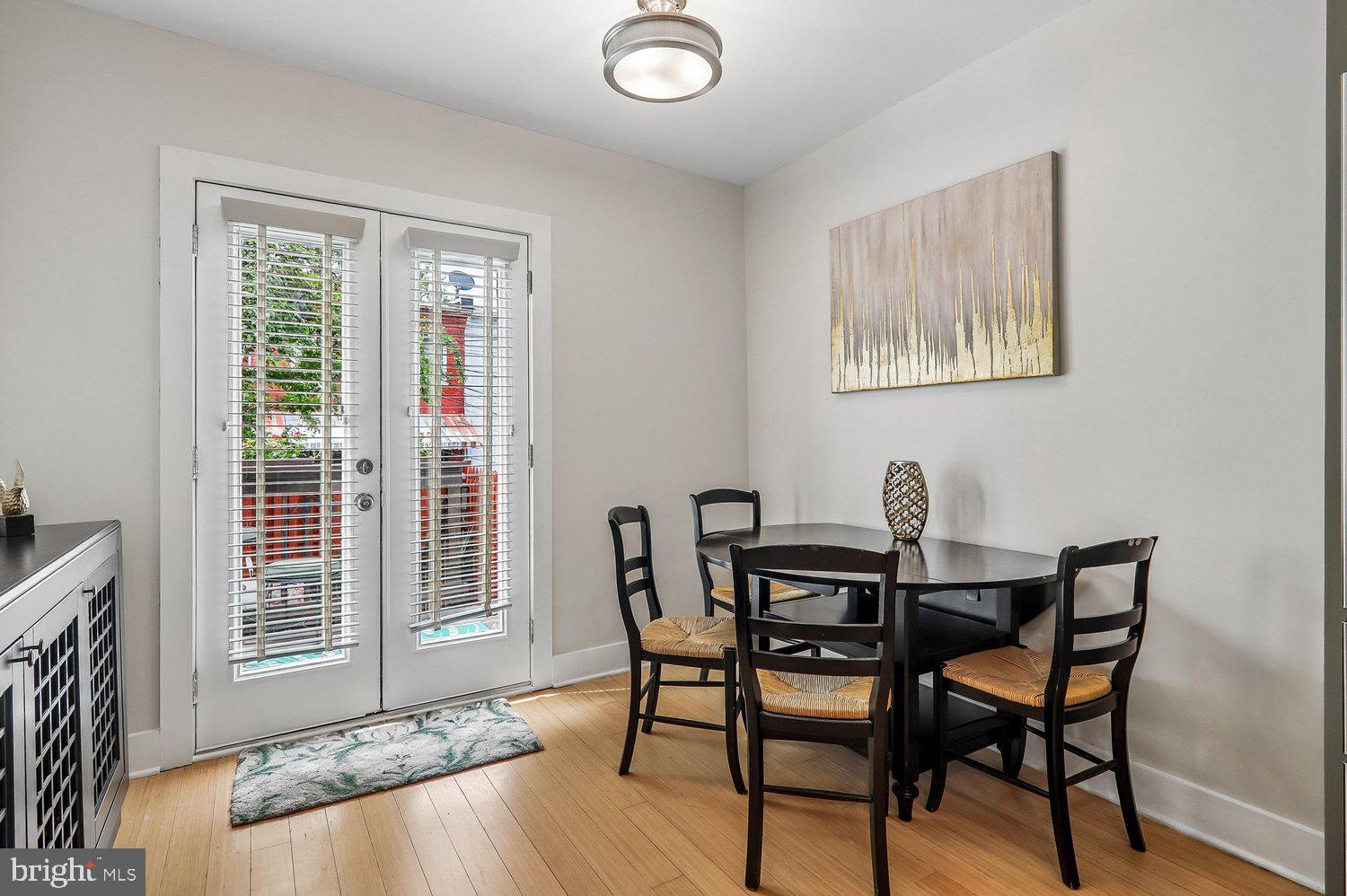 911 L Street Northeast Washington, DC 20002 - Photo 15 of 48 a view of a dining room with furniture and wooden floor