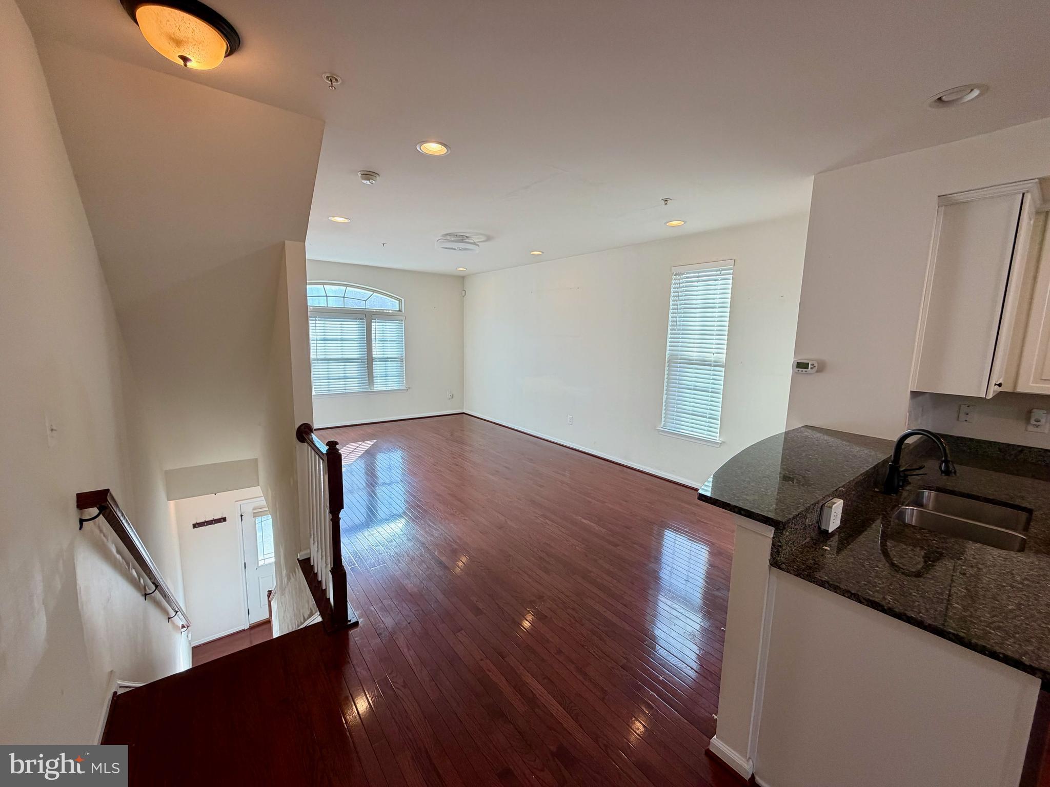 7729 Duncannon Lane Hanover, MD 21076 - Photo 11 of 26 a living room with wooden floor and a window
