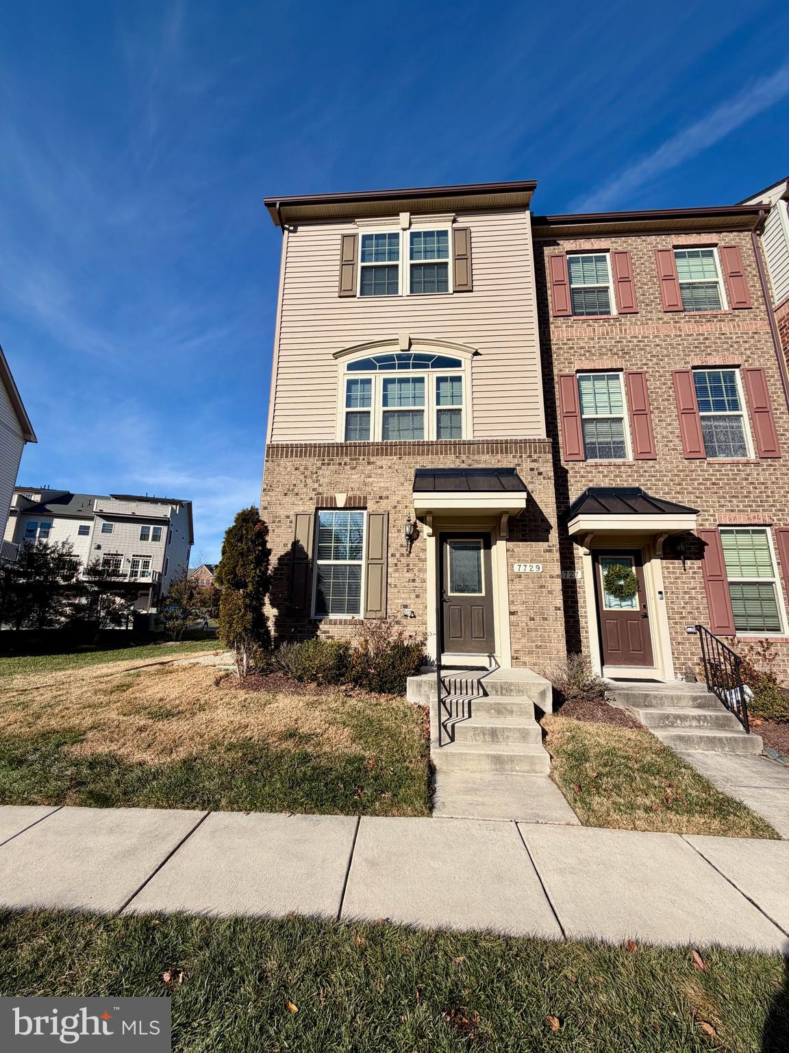 7729 Duncannon Lane Hanover, MD 21076 - Photo 2 of 26 a front view of a house with a garden