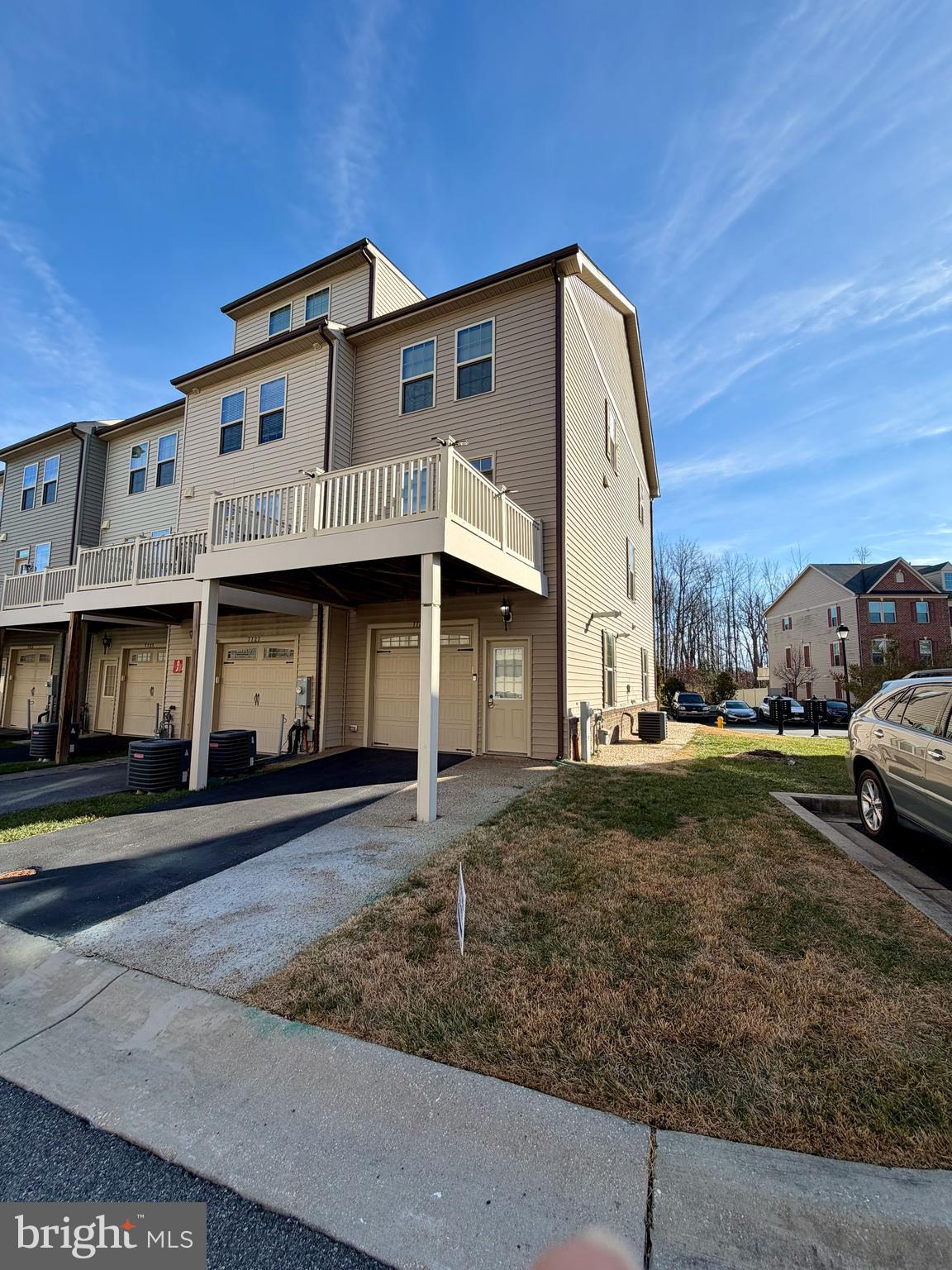7729 Duncannon Lane Hanover, MD 21076 - Photo 25 of 26 a front view of a house with a yard
