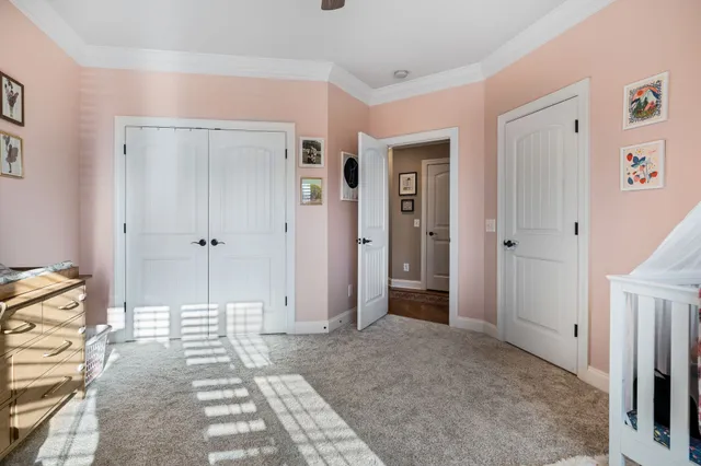 a bedroom with bed and a window