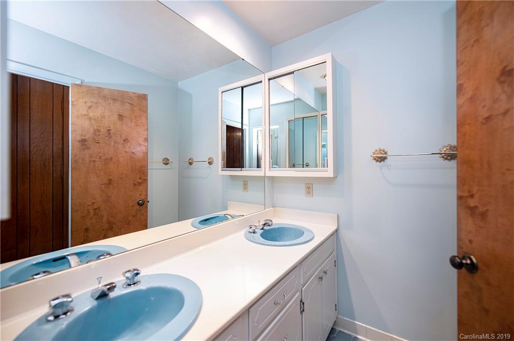 3703 High Ridge Road Charlotte, NC 28270 - Photo 14 of 25 a bathroom with a sink and a mirror
