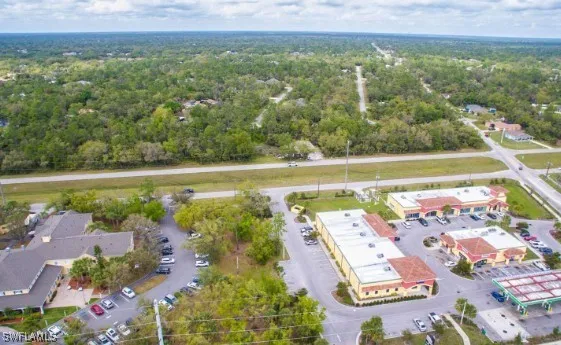 an aerial view of residential houses with outdoor space and river